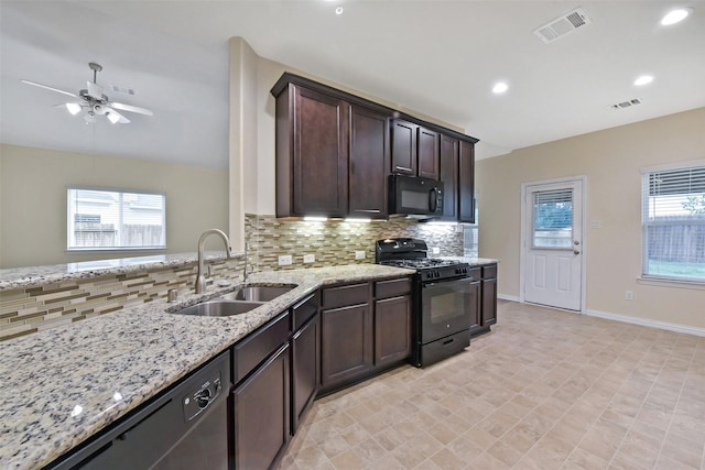 19823 White Pearl Ct, Houston, TX 77073 - kitchen with black appliances, light stone countertops, backsplash, a ceiling fan, and recessed lighting