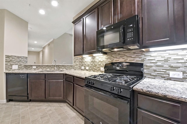 19823 White Pearl Ct, Houston, TX 77073 - kitchen featuring black appliances, dark brown cabinets, decorative backsplash, light stone counters, and recessed lighting