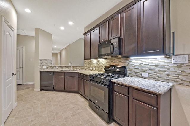 19823 White Pearl Ct, Houston, TX 77073 - kitchen featuring black appliances, dark brown cabinetry, decorative backsplash, light stone counters, and recessed lighting