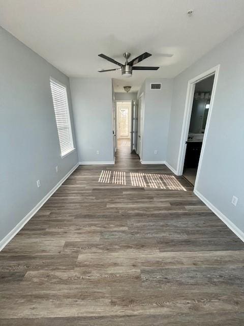 7575 Kirby Dr Unit 2314, Houston, TX 77030 - empty room featuring a ceiling fan, dark wood finished floors, and fire sprinkler in ceiling