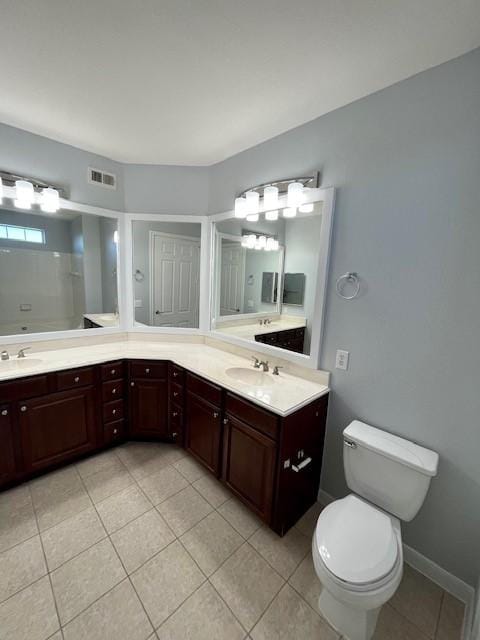 7575 Kirby Dr Unit 2314, Houston, TX 77030 - bathroom with tile patterned floors and double vanity
