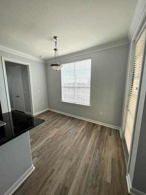 7575 Kirby Dr Unit 2314, Houston, TX 77030 - unfurnished dining area featuring ornamental molding and dark wood-type flooring