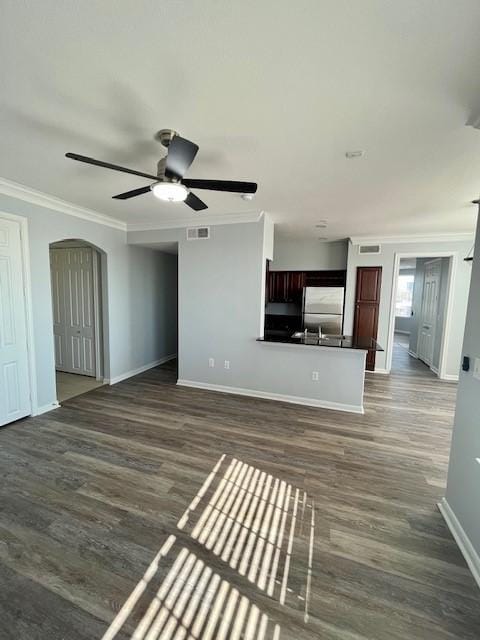 7575 Kirby Dr Unit 2314, Houston, TX 77030 - unfurnished living room with a ceiling fan, crown molding, dark wood finished floors, and arched walkways