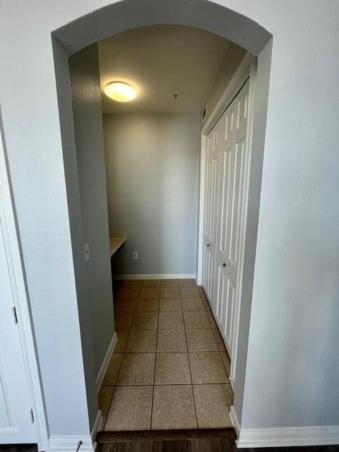 7575 Kirby Dr Unit 2314, Houston, TX 77030 - corridor with arched walkways and tile patterned flooring