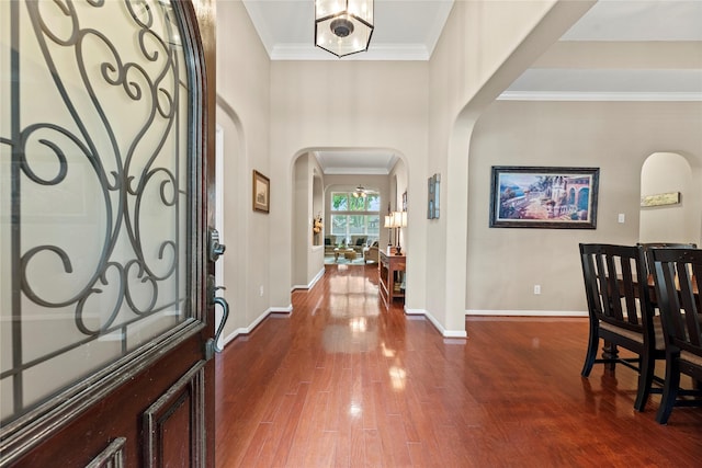 20811 S Amber Willow Trl, Cypress, TX 77433 - entryway with arched walkways, wood finished floors, and crown molding
