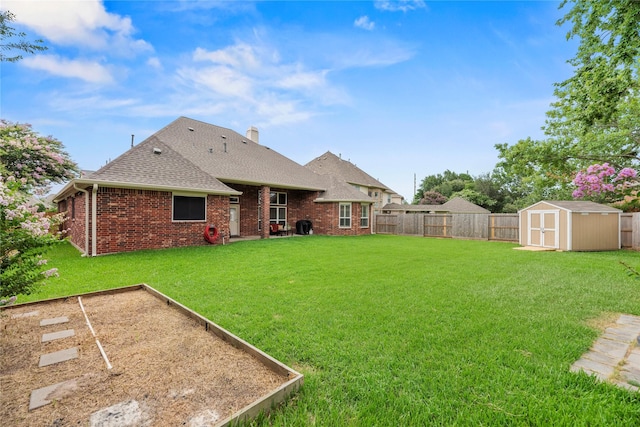 20811 S Amber Willow Trl, Cypress, TX 77433 - back of property featuring a shed, a garden, brick siding, and roof with shingles