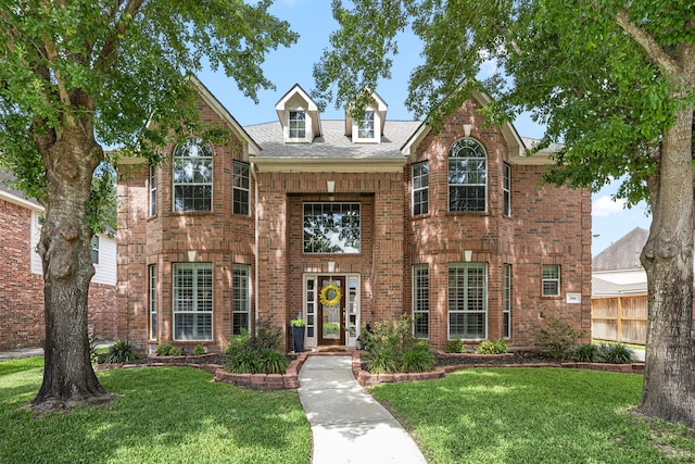 3506 Stanbury Place Ln, Katy, TX 77494 - traditional-style house featuring a front lawn, brick siding, and roof with shingles