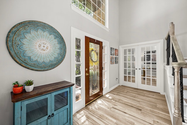 3506 Stanbury Place Ln, Katy, TX 77494 - entryway with french doors, a towering ceiling, and light wood-style flooring