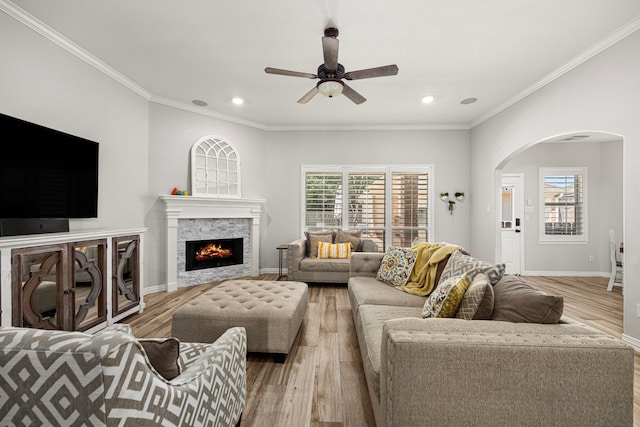 3506 Stanbury Place Ln, Katy, TX 77494 - living area with arched walkways, light wood-style flooring, ceiling fan, plenty of natural light, and recessed lighting