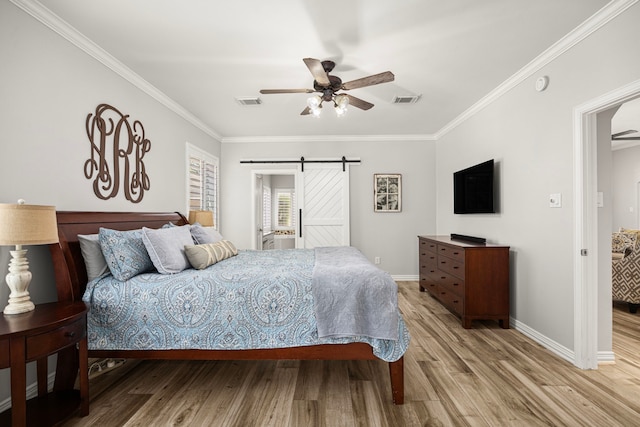 3506 Stanbury Place Ln, Katy, TX 77494 - bedroom with a barn door, light wood finished floors, ornamental molding, and ceiling fan