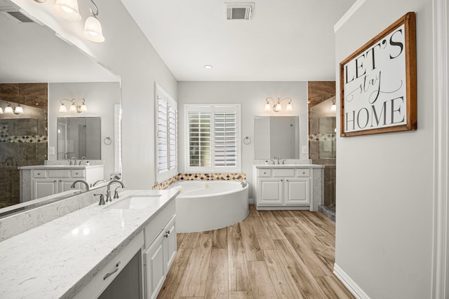 3506 Stanbury Place Ln, Katy, TX 77494 - full bath featuring a shower stall, wood finished floors, two vanities, and a tub to relax in
