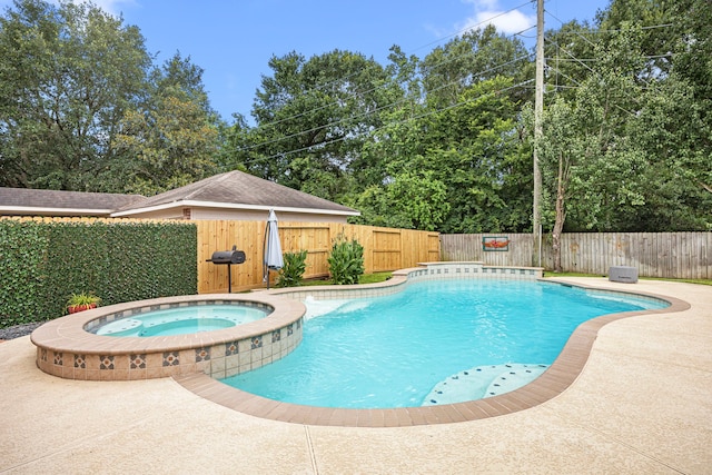 3506 Stanbury Place Ln, Katy, TX 77494 - view of swimming pool with a fenced backyard, a pool with connected hot tub, and a patio area