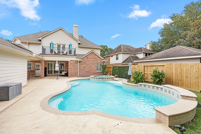 3506 Stanbury Place Ln, Katy, TX 77494 - view of pool with a fenced backyard, a pool with connected hot tub, and a patio
