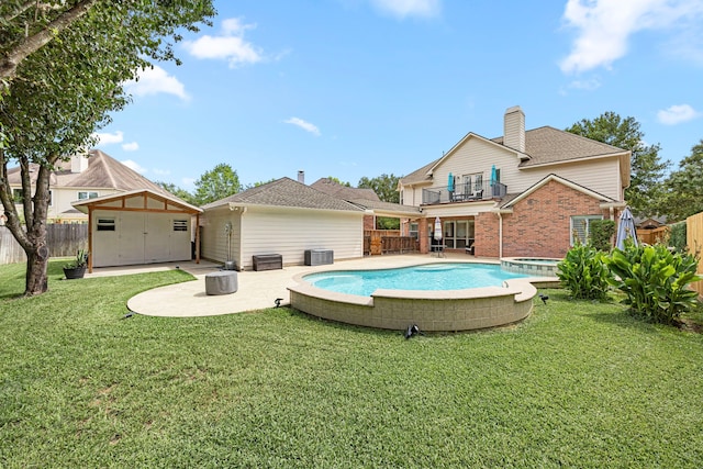 3506 Stanbury Place Ln, Katy, TX 77494 - view of pool with a storage unit, a fenced backyard, a patio area, and a pool with connected hot tub