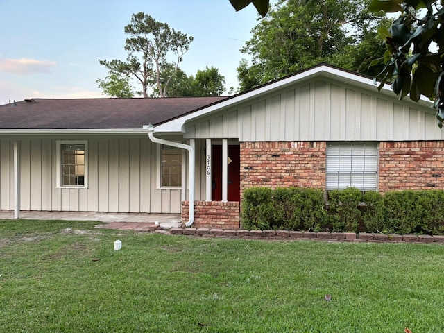 3706 Galway Ln, Houston, TX 77080 - single story home with board and batten siding, a front lawn, brick siding, and roof with shingles