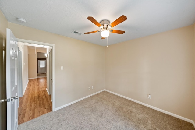5532 N Buffalo Cir, Willis, TX 77378 - spare room featuring attic access, ceiling fan, light carpet, and a smoke detector