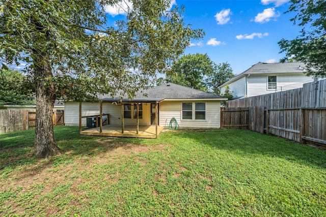 5532 N Buffalo Cir, Willis, TX 77378 - back of house featuring a deck and a fenced backyard