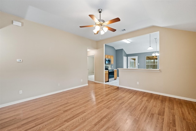 5532 N Buffalo Cir, Willis, TX 77378 - unfurnished living room with light wood finished floors, vaulted ceiling, and a ceiling fan