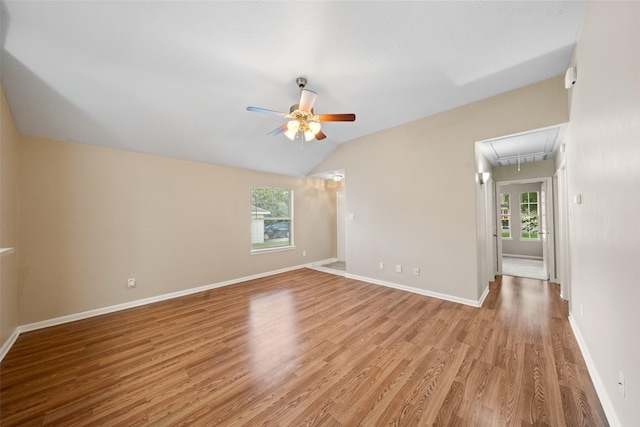 5532 N Buffalo Cir, Willis, TX 77378 - empty room with attic access, light wood finished floors, a ceiling fan, and vaulted ceiling