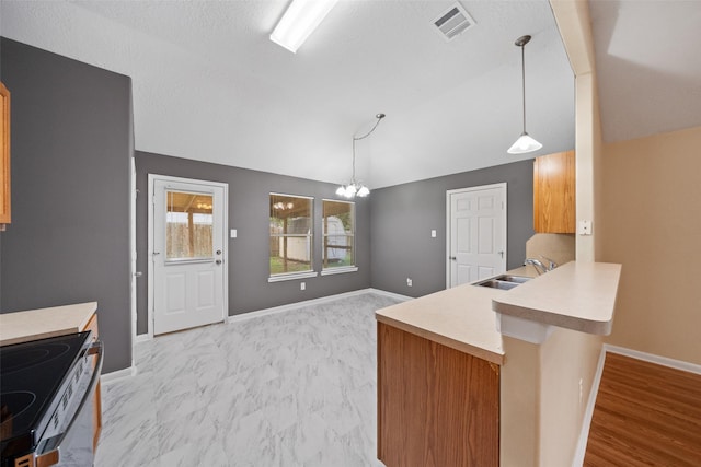 5532 N Buffalo Cir, Willis, TX 77378 - kitchen featuring electric stove, a chandelier, light countertops, a peninsula, and vaulted ceiling