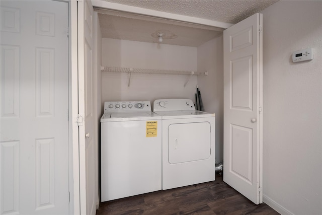 2300 Old Spanish Trl Unit 2063, Houston, TX 77054 - washroom with independent washer and dryer, dark wood-type flooring, and a textured ceiling