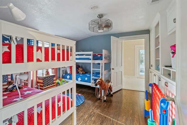 91 Willow St, Point Blank, TX 77364 - bedroom featuring wood finished floors, vaulted ceiling, and a textured ceiling