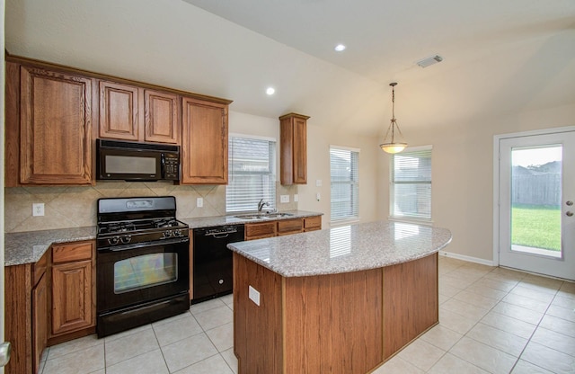 1814 High Falls Ln, Pearland, TX 77581 - kitchen featuring black appliances, vaulted ceiling, light tile patterned flooring, brown cabinetry, and plenty of natural light