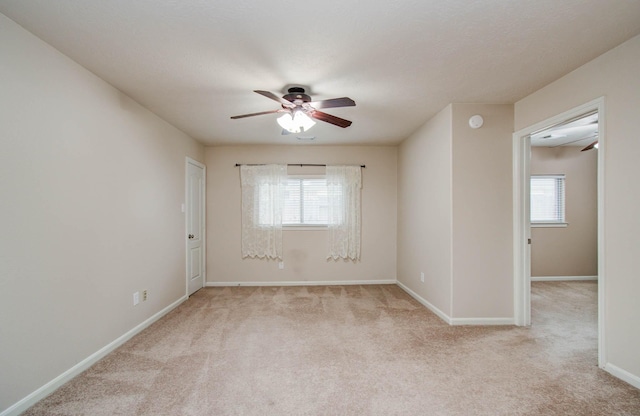1814 High Falls Ln, Pearland, TX 77581 - unfurnished room featuring a ceiling fan, plenty of natural light, and light colored carpet