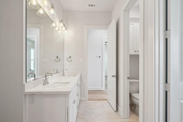 26726 Estuary Dr, Galveston, TX 77554 - bathroom with double vanity and marble finish flooring