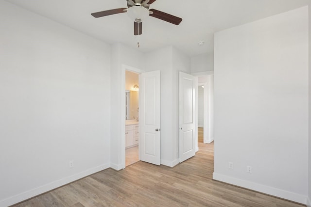 26726 Estuary Dr, Galveston, TX 77554 - unfurnished bedroom with light wood-style flooring, ensuite bath, and ceiling fan