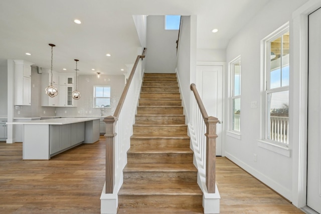 26726 Estuary Dr, Galveston, TX 77554 - stairs with recessed lighting and wood finished floors