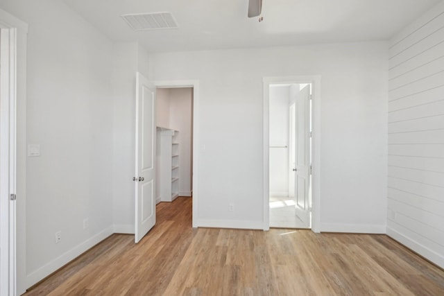 26726 Estuary Dr, Galveston, TX 77554 - unfurnished bedroom with light wood-style flooring and baseboards