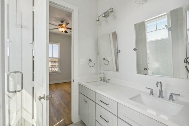 26726 Estuary Dr, Galveston, TX 77554 - bathroom featuring plenty of natural light, a shower with shower door, and double vanity