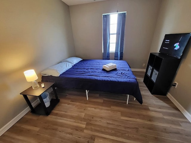 211 Peach St, Sweeny, TX 77480 - bedroom featuring wood finished floors and baseboards
