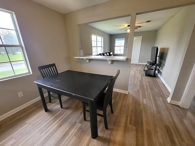 211 Peach St, Sweeny, TX 77480 - dining area with wood finished floors and a ceiling fan