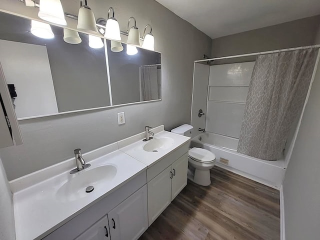 211 Peach St, Sweeny, TX 77480 - bathroom featuring shower / tub combo with curtain, double vanity, and wood finished floors