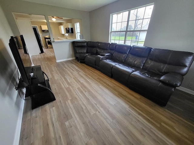 211 Peach St, Sweeny, TX 77480 - living room featuring light wood-style floors and ceiling fan