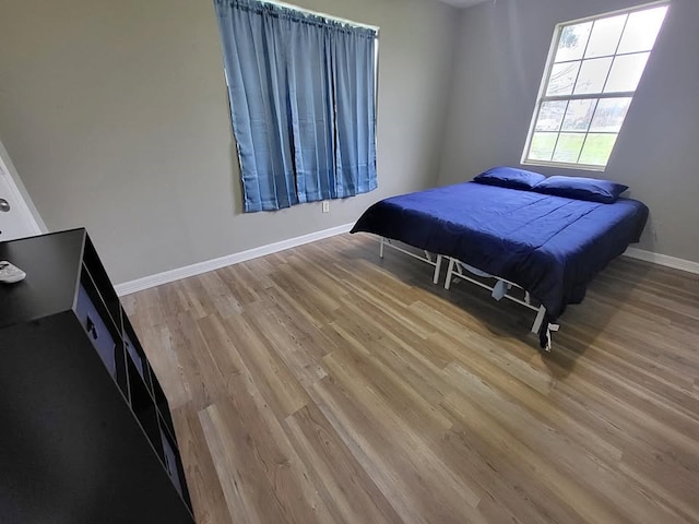 211 Peach St, Sweeny, TX 77480 - bedroom featuring wood finished floors and baseboards