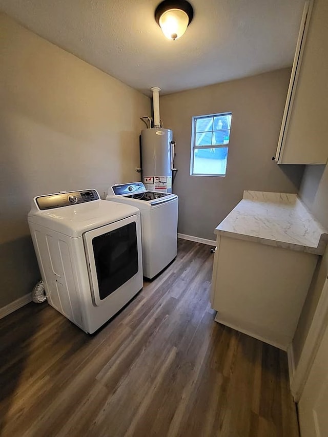 211 Peach St, Sweeny, TX 77480 - laundry room featuring gas water heater, cabinet space, washing machine and dryer, and dark wood finished floors