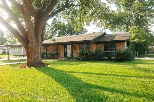 4640 Fieldwood Ln, Beaumont, TX 77706 - single story home with a front yard and brick siding