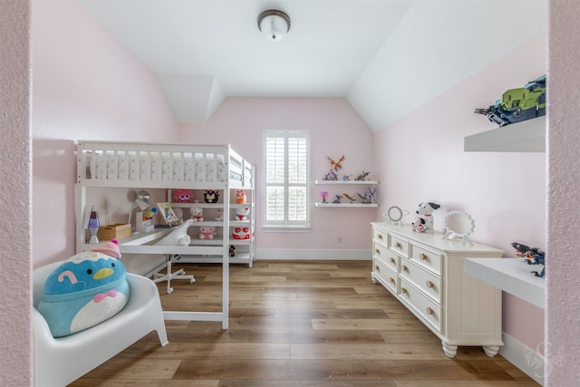 27706 Lakeway Trail Ln, Fulshear, TX 77441 - bedroom featuring light wood-type flooring and lofted ceiling