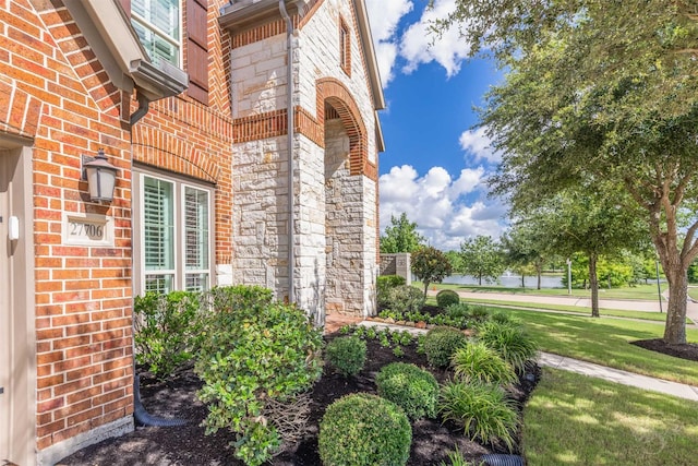27706 Lakeway Trail Ln, Fulshear, TX 77441 - doorway to property with brick siding and stone siding