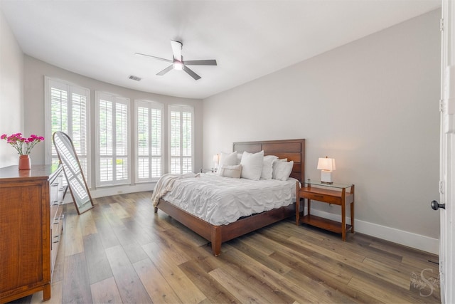 27706 Lakeway Trail Ln, Fulshear, TX 77441 - bedroom with wood finished floors and ceiling fan