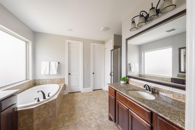 27706 Lakeway Trail Ln, Fulshear, TX 77441 - bathroom featuring vanity, a bath, a shower stall, and tile patterned flooring