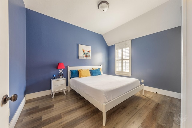 27706 Lakeway Trail Ln, Fulshear, TX 77441 - bedroom featuring vaulted ceiling and wood finished floors
