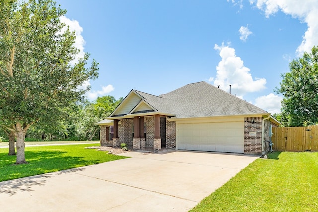 101 Brazos Ct, Richwood, TX 77531 - view of front of house with brick siding, an attached garage, driveway, roof with shingles, and a gate
