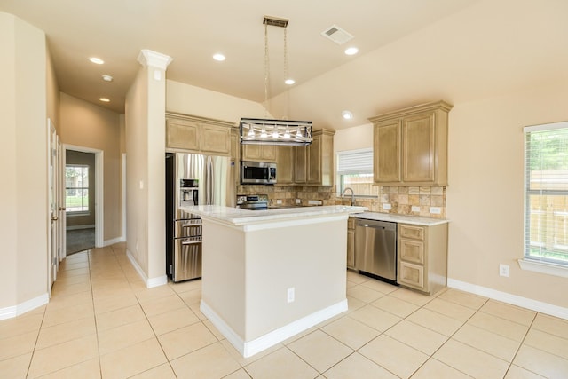101 Brazos Ct, Richwood, TX 77531 - kitchen featuring stainless steel appliances, light countertops, tasteful backsplash, plenty of natural light, and lofted ceiling