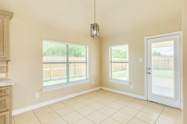101 Brazos Ct, Richwood, TX 77531 - unfurnished dining area with baseboards and light tile patterned floors