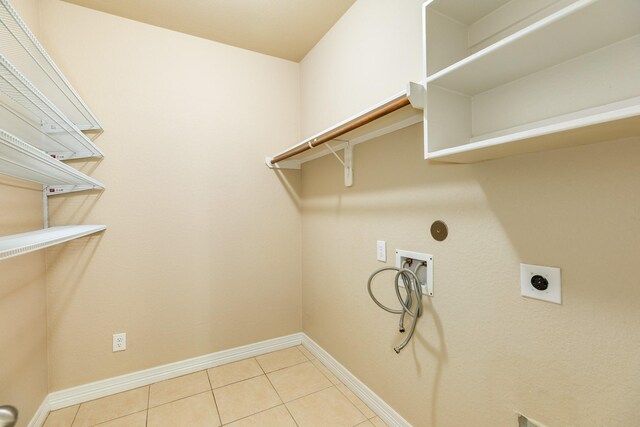 101 Brazos Ct, Richwood, TX 77531 - laundry area with washer hookup, hookup for an electric dryer, and tile patterned floors