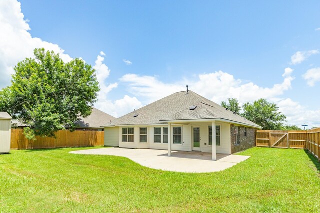 101 Brazos Ct, Richwood, TX 77531 - rear view of house with a patio, a fenced backyard, and a shingled roof